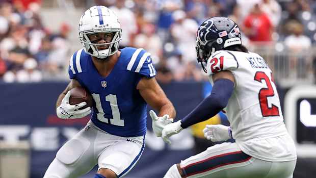 Sep 11, 2022; Houston, Texas, USA; Indianapolis Colts wide receiver Michael Pittman Jr. (11) runs with the. Ball as Houston Texans cornerback Steven Nelson (21) defends during the game at NRG Stadium. Mandatory Credit: Troy Taormina-USA TODAY Sports